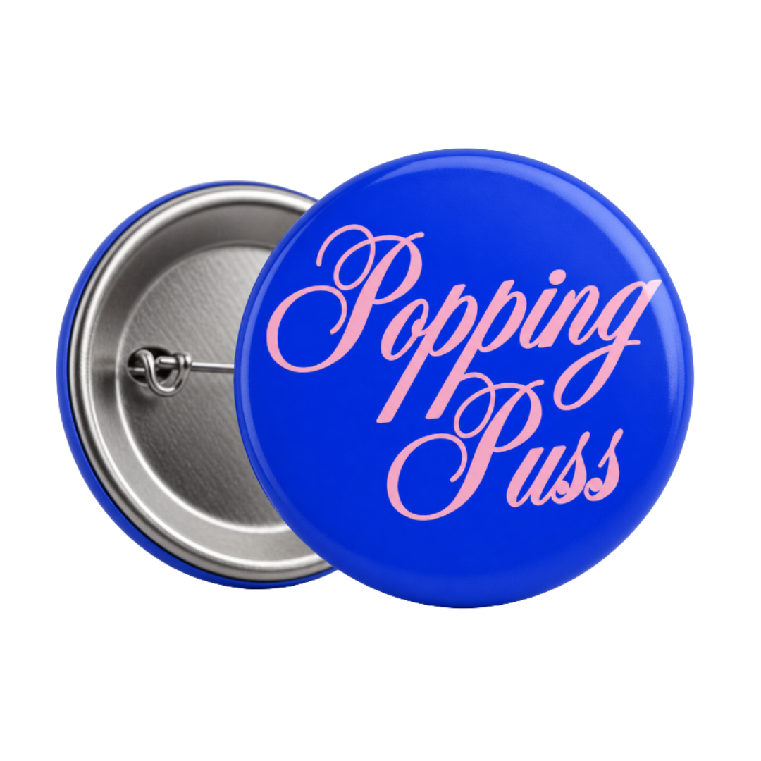 BLUE POPPING PUSS PIN BADGE