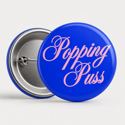 BLUE POPPING PUSS PIN BADGE